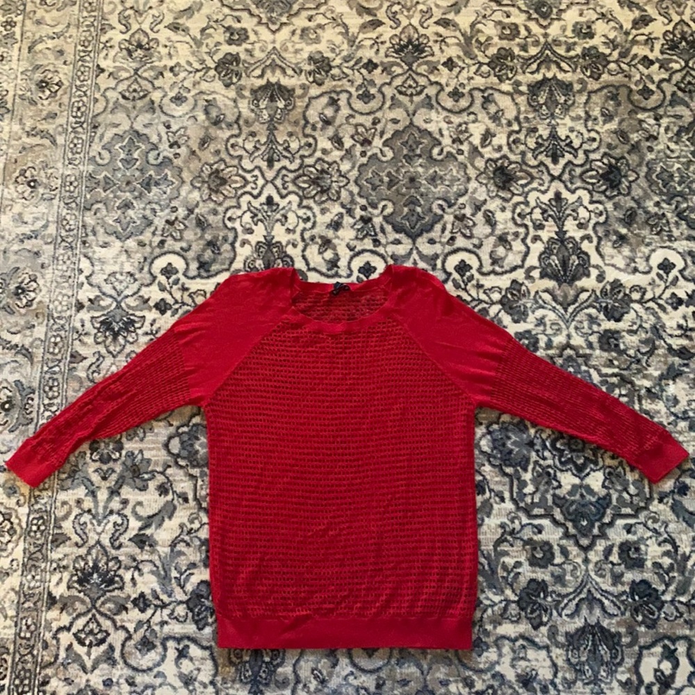 Red sweater with see through holes